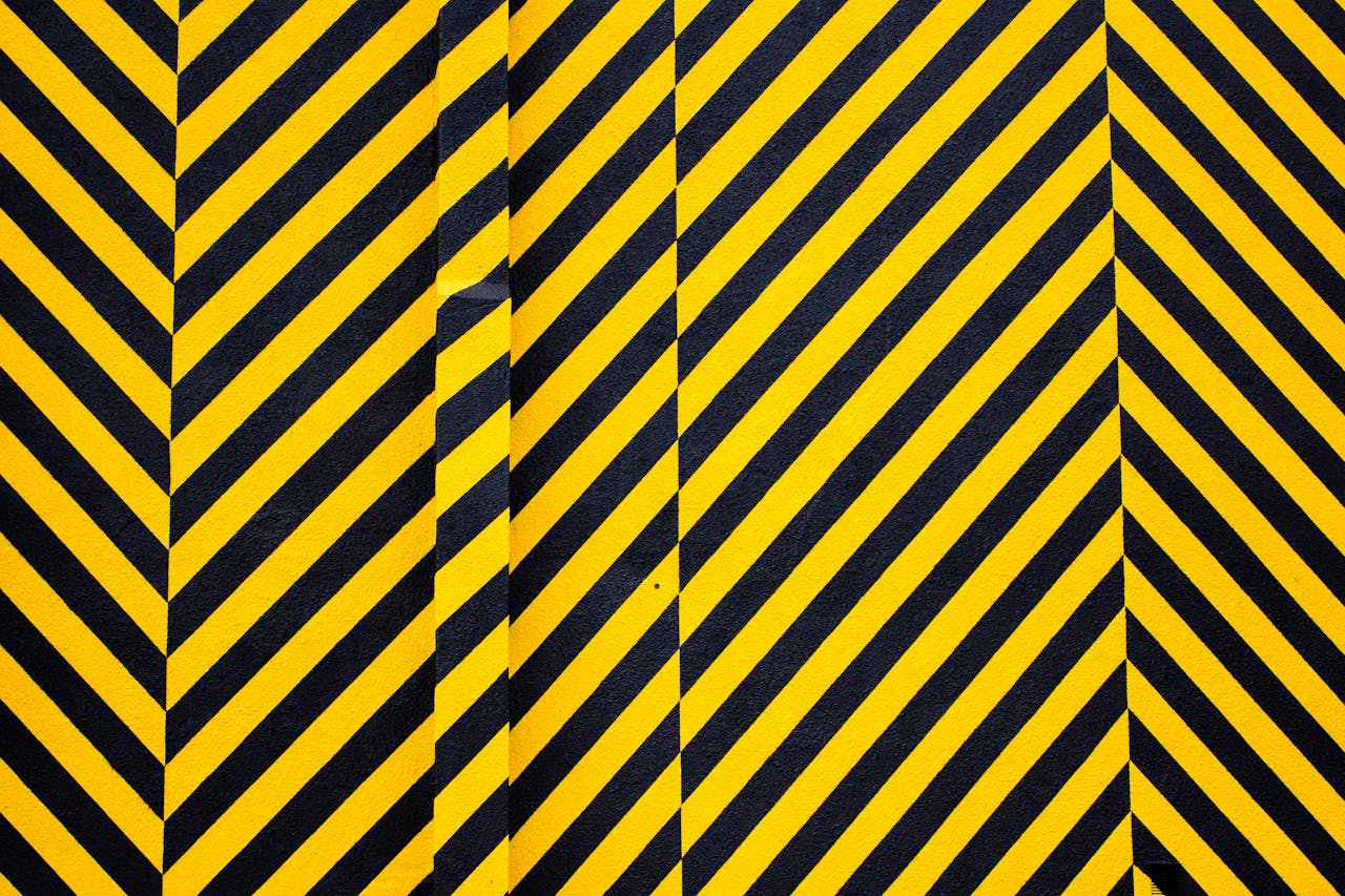services-02 Dynamic yellow and black patterned background with bold diagonal stripes for creative design use.